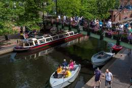 People walking over the bridge at brindley Place