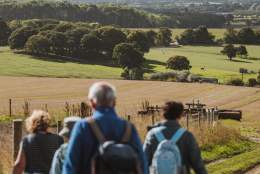 A group of walkers looking out across the Yorkshire Wolds in East Yorkshire