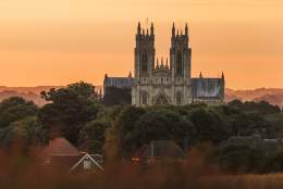Beverley minster in the forefront with the sunset behind.