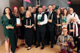 winners with their trophies from the 2022 REYTA awards