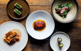 Photo of lots of plates with colourul food