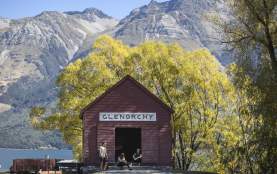 Friends sitting outside the Glenorchy Red Shed