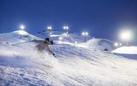 Woman skiing at night
