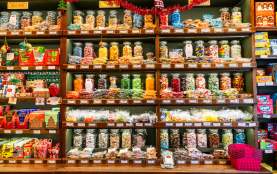 Wide shot of shelves lined with colourful sweets