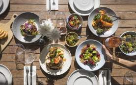 Top view of a selections of colourful lunch dishes