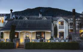 Outside shot of Botswana Butchery Restaurant historic building at dusk