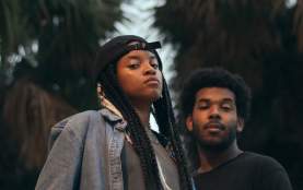 Two members of Magna Carda pose and look at camera