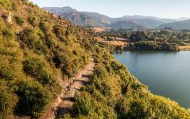 Aerial view of lake and mountains in the distance