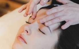 A person getting a facial massage.