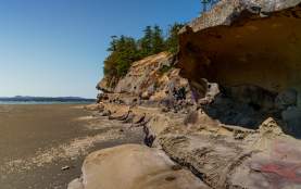 Sandstone cliffs, tide it out.