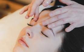 A person getting a facial massage.