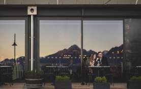 Two people dining out front of The Grille by Eichardt's Restaurant