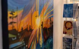 Close-up of a painting of a sunset.