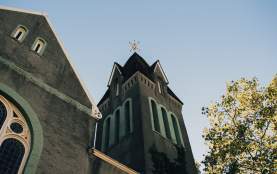 Staring up a large church tower
