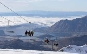 People riding the chairlift at Treble Cone Ski Field, Wānaka