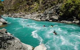 Group of people boarding down the river