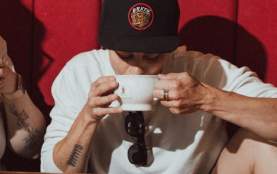 A couple drinking coffee together.
