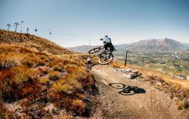 Friends riding at Coronet Peak Bike Park