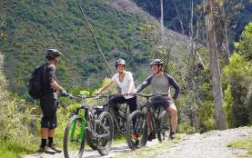 Group of people on a guided mountain biking tour. Credit The Ride Guide Queenstown
