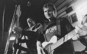 black and white photo of Butch Hancock and The Sunspots playing guitar at Burger Tex