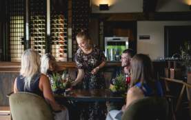 Waitress serving guests at Amisfield Restaurant