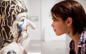 Young girl staring at a sculpture at the Nanaimo Art Gallery.