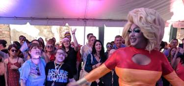 Drag Queen Sarah Jessica Darker dancing in front of NKY Pride crowd at Hotel Covington