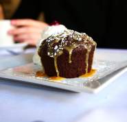 A chocolate cake drizzled in caramel.