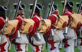 revolutionary war reenactment soldiers standing in a line