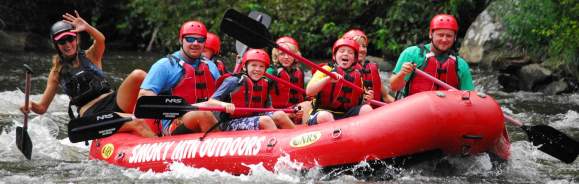 A group takes on the waves during a white-water rafting trip near Gatlinburg, TN.