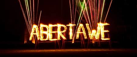 The word 'Abertawe' in fire with lasers