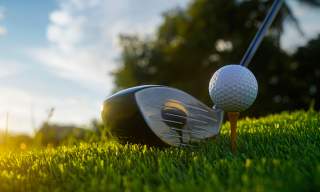 Golf ball and golf club on the golf course