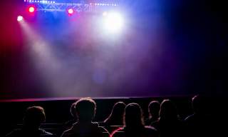Photograph of a student night performance about to start at the New Theatre Royal in Portsmouth