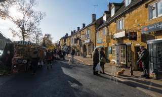 People shopping at the popular market in Moreton in Marsh in the Cotswolds