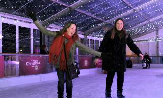 Two ladies ice skating at Cheltenham Ice Rink