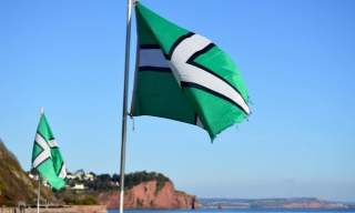 devon flag against blue skies