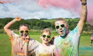 family covered in coloured paint