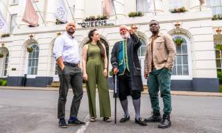 Group tour Cheltenham. Group stood outside the Queens Hotel Cheltenham with tour guide Phil from Cheltenham Promenaders.