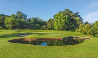View of one of the holes at Clandeboye Golf Club on a sunny day