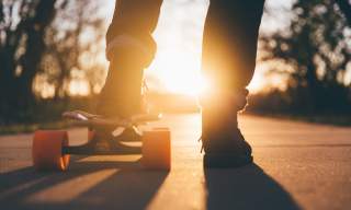 a picture of a person's legs and a skateboard