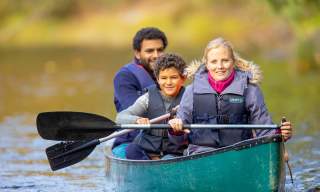 Family canoeing on Børtevann in Sarpsborg, Østfold.