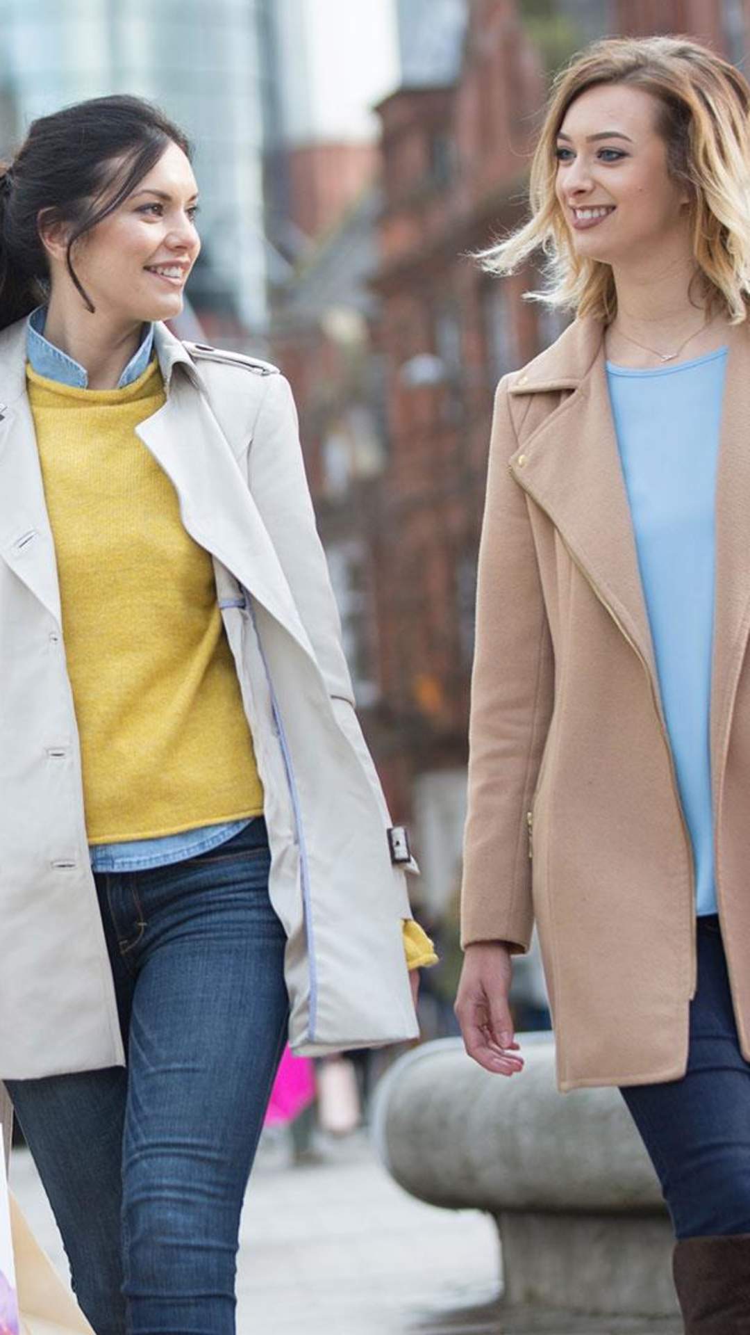 Two Ladies shopping in Belfast outside Victoria Square Shopping Centre.