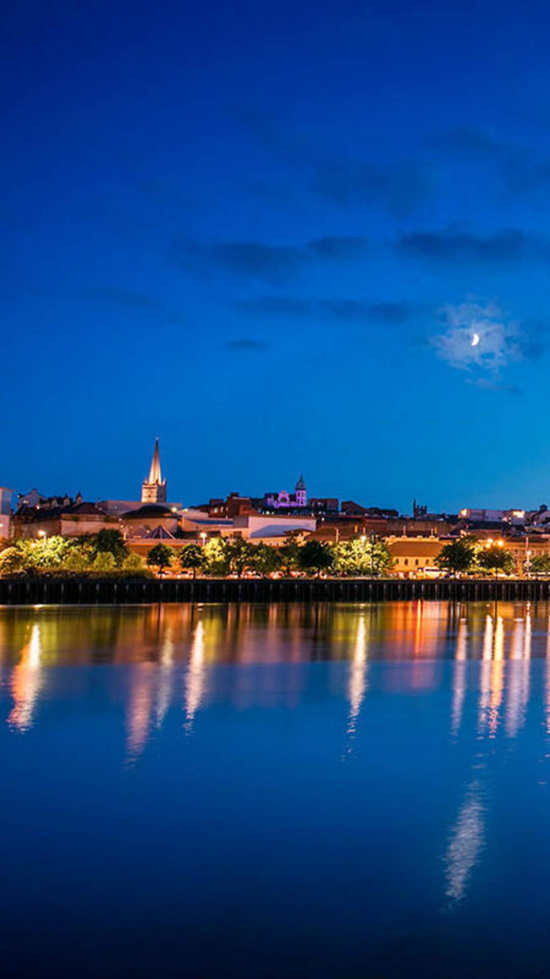 View of the peace bridge at night time towards Derry City