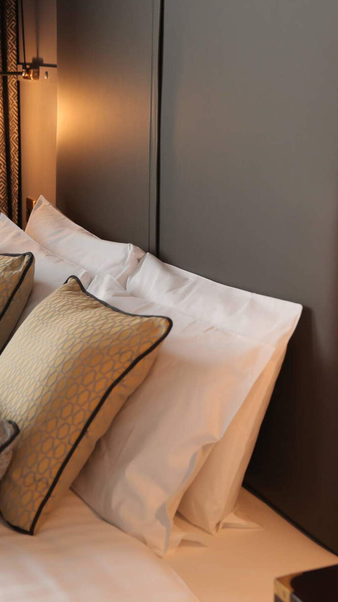 Modern, plush interior of a bedroom in the Titanic Hotel