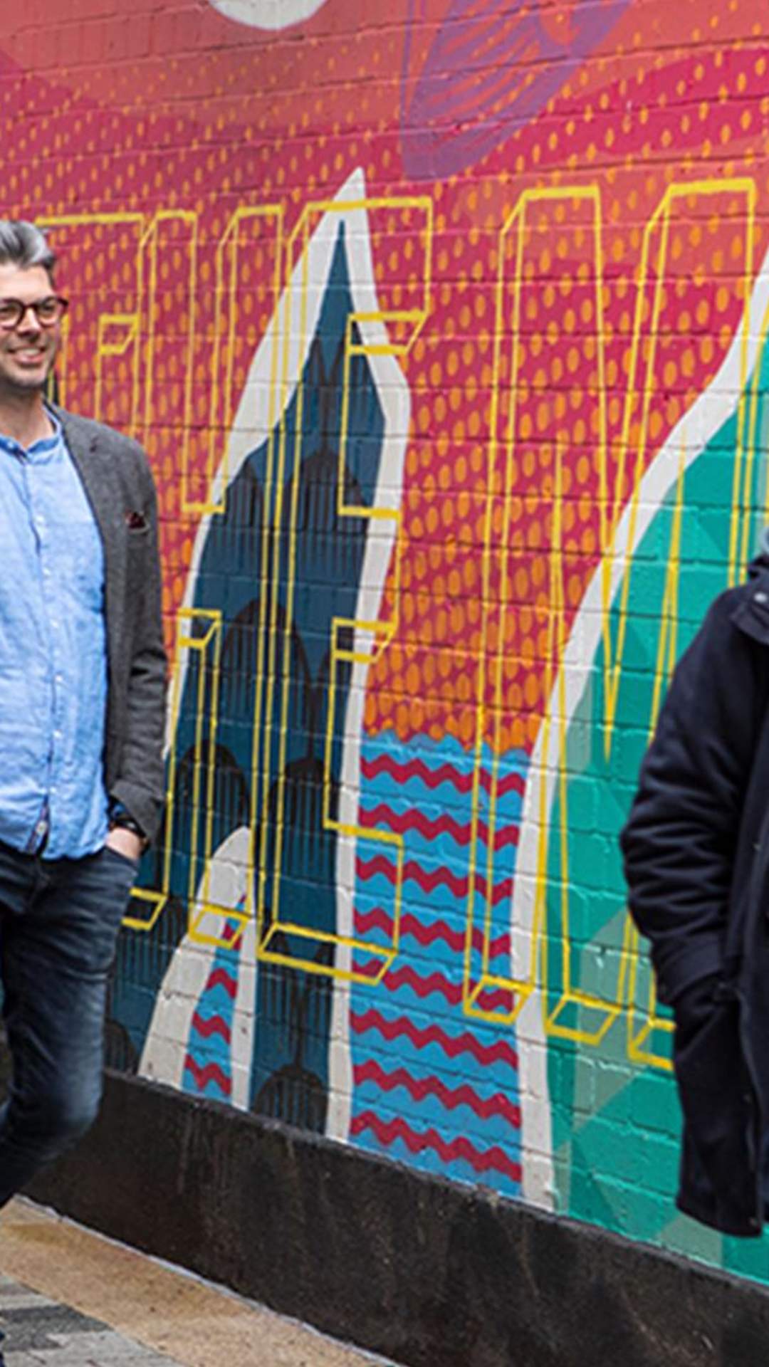 Group enjoying a street art walking tour with Seedhead Arts