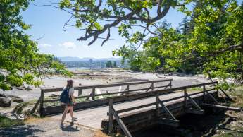 A person crossing a bridge.