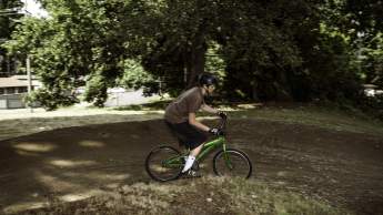 A person on a mountain bike riding down a dirt trail.