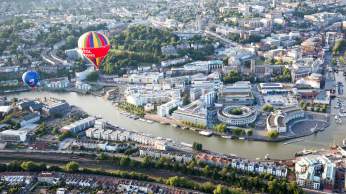 A balloon flying over Bristol Harbourside during the Bristol Balloon Fiesta - credit Paul Box