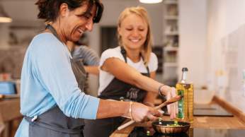 Two women at a cooking class in Bristol - credit Yuup