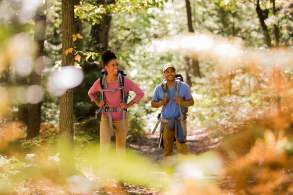 Couple with backpacks hiking the Appalachian Trail